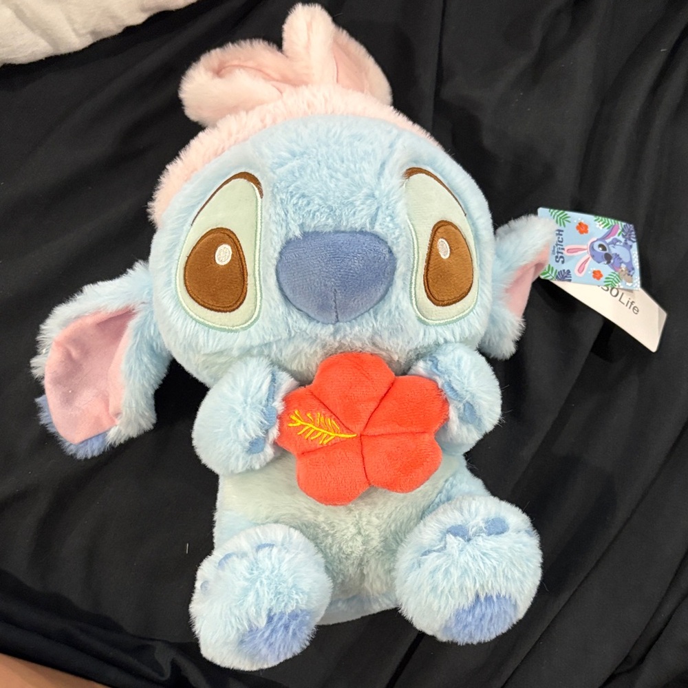 Blue and Pink Stuffed Animal with Flower